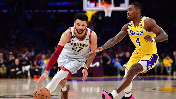 May 22, 2023; Los Angeles, California, USA; Denver Nuggets guard Jamal Murray (27) drives to the basket against Los Angeles Lakers guard Lonnie Walker IV (4) during the second quarter in game four of the Western Conference Finals for the 2023 NBA playoffs at Crypto.com Arena. Mandatory Credit: Gary A. Vasquez-Imagn Images