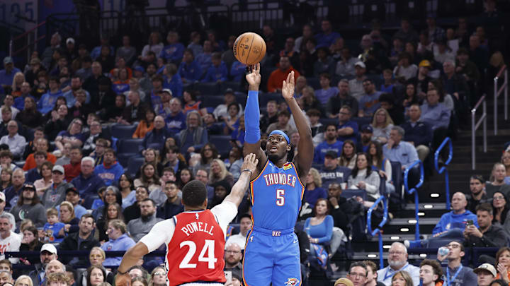 Jan 2, 2025; Oklahoma City, Oklahoma, USA; Oklahoma City Thunder guard Luguentz Dort (5) shoots a three point basket over Los Angeles Clippers guard Norman Powell (24) during the second quarter at Paycom Center. Mandatory Credit: Alonzo Adams-Imagn Images Jan 2, 2025; Oklahoma City, Oklahoma, USA; Oklahoma City Thunder guard Luguentz Dort (5) shoots a three point basket over Los Angeles Clippers guard Norman Powell (24) during the second quarter at Paycom Center. Mandatory Credit: Alonzo Adams-Imagn Images