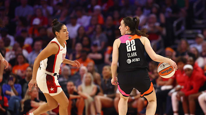 Jul 20, 2024; Phoenix, AZ, USA; Team WNBA guard Caitlin Clark (22) against USA Women's National Team player Kelsey Plum (5) at Footprint Center. Mandatory Credit: Mark J. Rebilas-Imagn Images