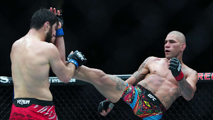 Mar 8, 2025; Las Vegas, Nevada, USA; Alex Pereira (red gloves) fights Magomed Ankalaev (blue gloves) during UFC 313 at T-Mobile Arena. Mandatory Credit: Stephen R. Sylvanie-Imagn Images