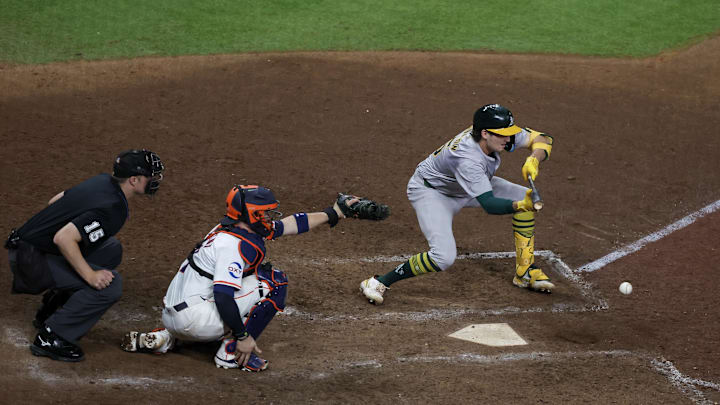 Oakland Athletics shortstop Jacob Wilson bunts in the 10th inning of Tuesday's 4-3 win over the Houston Astros at Minute Maid Park. Oakland Athletics shortstop Jacob Wilson bunts in the 10th inning of Tuesday's 4-3 win over the Houston Astros at Minute Maid Park.
