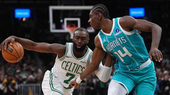 Boston Celtics guard Jaylen Brown (7) drive the ball against Charlotte Hornets forward Moussa Diabate Boston Celtics guard Jaylen Brown (7) drive the ball against Charlotte Hornets forward Moussa Diabate