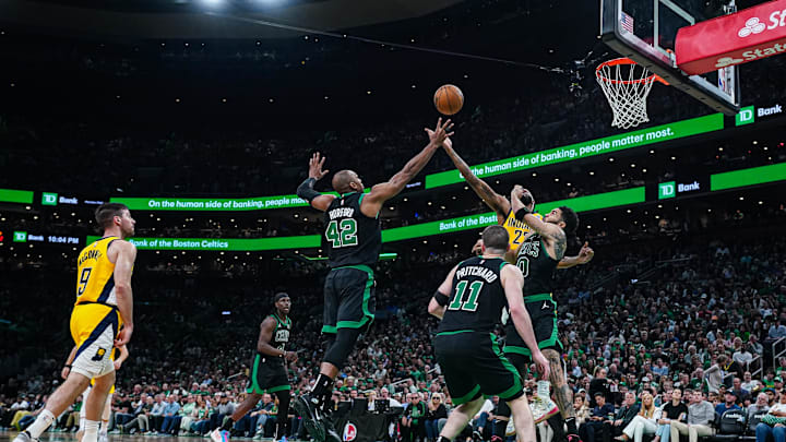 May 23, 2024; Boston, Massachusetts, USA; Boston Celtics center Al Horford (42) and forward Jayson Tatum (0) work for the ball against Indiana Pacers forward Isaiah Jackson (22) in the second half during game two of the eastern conference finals for the 2024 NBA playoffs at TD Garden. Mandatory Credit: David Butler II-Imagn Images