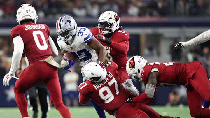 Nov 3, 2025; Arlington, Texas, USA; Dallas Cowboys running back Javonte Williams (33) runs against Arizona Cardinals defensive tackle Walter Nolen III (97) in the second half at AT&T Stadium. Mandatory Credit: Kevin Jairaj-Imagn Images