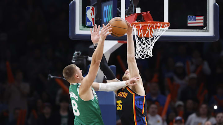 Isaiah Hartenstein blocks Kristaps Porzingis at the rim during the fourth quarter of the Thunder’s win over the Celtics.