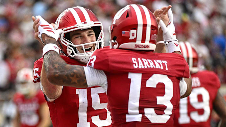 Oct 18, 2025; Bloomington, Indiana, USA; Indiana Hoosiers quarterback Fernando Mendoza (15) and wide receiver Elijah Sarratt (13) celebrate after a touchdown during the second half against the Michigan State Spartans at Memorial Stadium. Mandatory Credit: Robert Goddin-Imagn Images