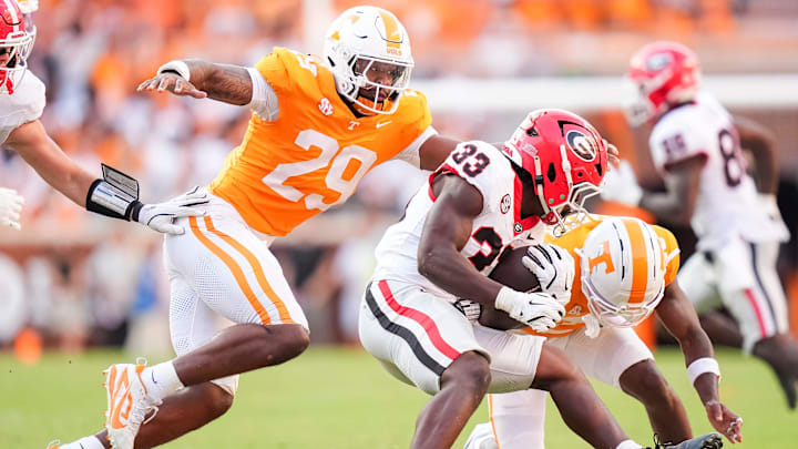 Tennessee defensive lineman Jordan Ross (29) goes in to tackle Georgia running back Chauncey Bowens (33) during a college football game between Tennessee and Georgia at Neyland Stadium in Knoxville, Tenn., on Sept. 13, 2025.