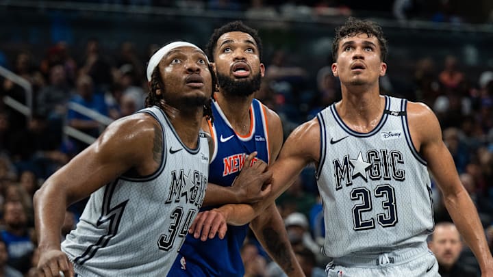 Dec 15, 2024; Orlando, Florida, USA; Orlando Magic forward Wendell Carter Jr. and forward Tristan da Silva (23) defend New York Knicks center Karl-Anthony Towns (32) against a rebound in the second quarter at Kia Center. Mandatory Credit: Jeremy Reper-Imagn Images Dec 15, 2024; Orlando, Florida, USA; Orlando Magic forward Wendell Carter Jr. and forward Tristan da Silva (23) defend New York Knicks center Karl-Anthony Towns (32) against a rebound in the second quarter at Kia Center. Mandatory Credit: Jeremy Reper-Imagn Images