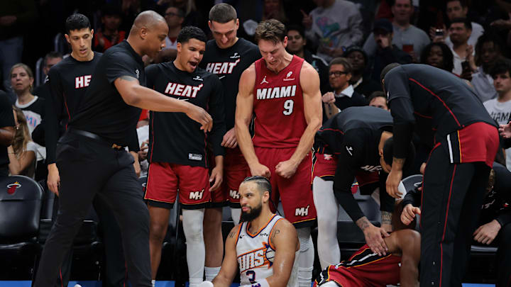 Jan 13, 2026; Miami, Florida, USA; Miami Heat guard Pelle Larsson (9) reacts from the bench against Phoenix Suns forward Dillon Brooks (3) during the fourth quarter at Kaseya Center. Mandatory Credit: Sam Navarro-Imagn Images