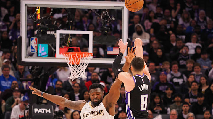 Feb 8, 2025; Sacramento, California, USA; Sacramento Kings guard Zach LaVine (8) scores a basket against New Orleans Pelicans forward Zion Williamson (1) during the third quarter at Golden 1 Center. Mandatory Credit: Kelley L Cox-Imagn Images