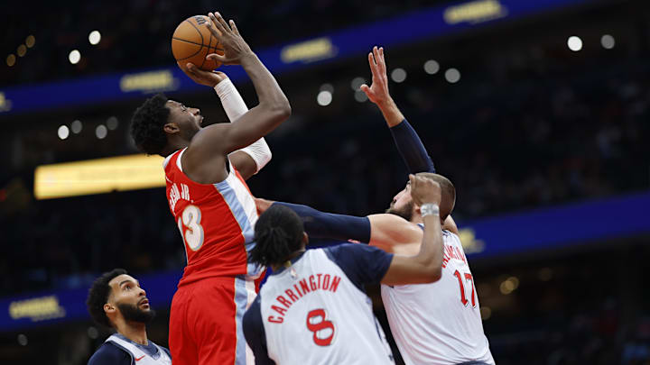 Dec 8, 2024; Washington, District of Columbia, USA; Memphis Grizzlies forward Jaren Jackson Jr. (13) shoots the ball as Washington Wizards center Jonas Valanciunas (17) defends in the third quarter at Capital One Arena. Mandatory Credit: Geoff Burke-Imagn Images