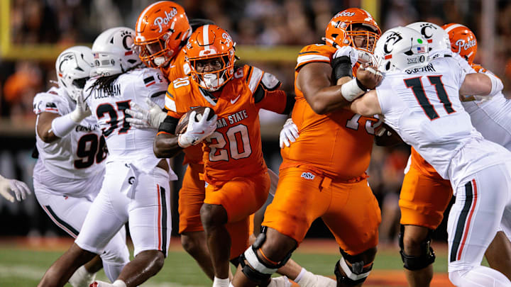 Oct 18, 2025; Stillwater, Oklahoma, USA; Oklahoma State Cowboys running back Rodney Fields Jr. (20) runs the ball during the first half against the Cincinnati Bearcats at Boone Pickens Stadium. Mandatory Credit: William Purnell-Imagn Images