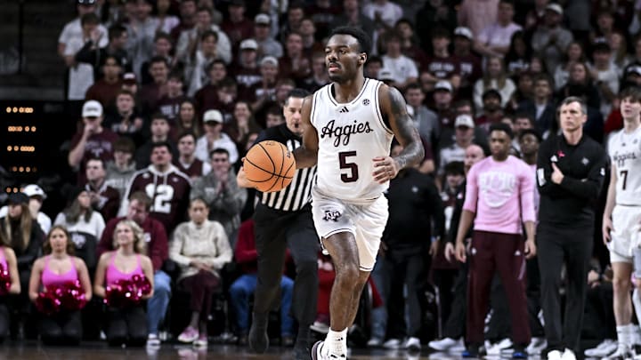 Jan 24, 2026; College Station, Texas, USA; Texas A&M Aggies guard Jacari Lane (5) dribbles the ball during the first half against the South Carolina Gamecocks at Reed Arena. Mandatory Credit: Maria Lysaker-Imagn Images 