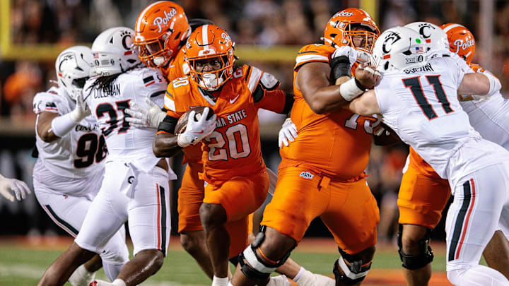 Oct 18, 2025; Stillwater, Oklahoma, USA; Oklahoma State Cowboys running back Rodney Fields Jr. (20) runs the ball during the first half against the Cincinnati Bearcats at Boone Pickens Stadium. Mandatory Credit: William Purnell-Imagn Images Oct 18, 2025; Stillwater, Oklahoma, USA; Oklahoma State Cowboys running back Rodney Fields Jr. (20) runs the ball during the first half against the Cincinnati Bearcats at Boone Pickens Stadium. Mandatory Credit: William Purnell-Imagn Images