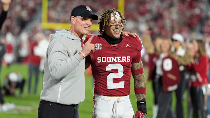 Oklahoma coach Brent Venables poses with Oklahoma Sooners defensive back Billy Bowman Jr. (2) during senior night before a college football game between the University of Oklahoma Sooners (OU) and the Alabama Crimson Tide at Gaylord Family - Oklahoma Memorial Stadium in Norman, Okla., Saturday, Nov. 23, 2024.