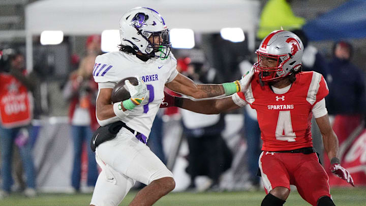 Dec 6, 2024; Birmingham, AL, USA; Parker's Na'eem Offord (1) tries to get around Saraland's Arterus Moffett (4) as he runs the ball at Protective Stadium in the 6A State Championship game. Parker defeated Saraland 28-17. Dec 6, 2024; Birmingham, AL, USA; Parker's Na'eem Offord (1) tries to get around Saraland's Arterus Moffett (4) as he runs the ball at Protective Stadium in the 6A State Championship game. Parker defeated Saraland 28-17.