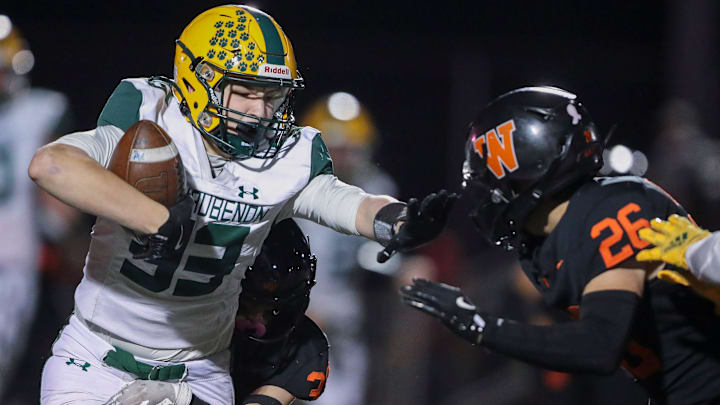 Ashwaubenon High School's Abel Schubring (33) stiff-arms West De Pere High School's Ethan Collar (26) as he is tackled by Mason Werner (33) on Friday, October 4, 2024, at West De Pere High School in De Pere, Wis. West De Pere won the game, 47-13.
Tork Mason/USA TODAY NETWORK-Wisconsin