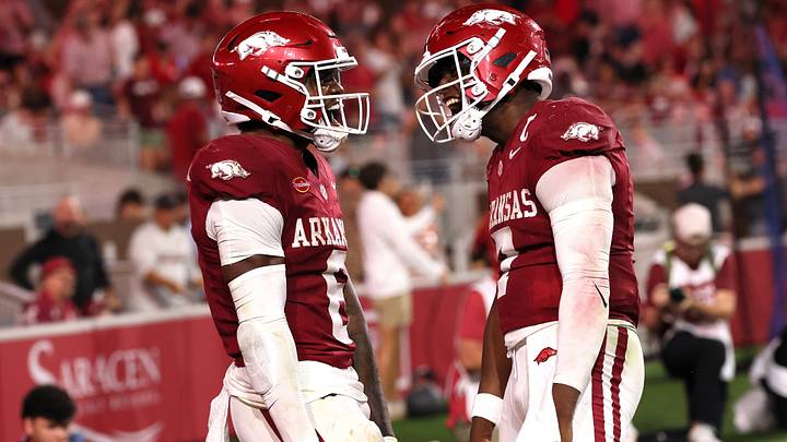 Arkansas Razorbacks wide receiver Chris Marshall (6) celebrates with quarterback KJ Jackson (7) after scoring a touchdown during the third quarter against the Tulsa Golden Hurricanes at Donald W. Reynolds Razorback Stadium. Arkansas Razorbacks wide receiver Chris Marshall (6) celebrates with quarterback KJ Jackson (7) after scoring a touchdown during the third quarter against the Tulsa Golden Hurricanes at Donald W. Reynolds Razorback Stadium.