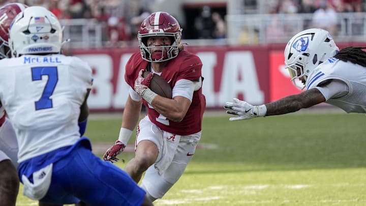 Nov 22, 2025; Tuscaloosa, Alabama, USA;  Alabama wide receiver Cole Adams (7) runs with the ball as Eastern Illinois tacklers close in at Saban Field at Bryant-Denny Stadium. Mandatory Credit: Gary Cosby Jr.-Imagn Images