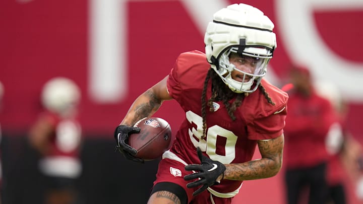 Arizona Cardinals receiver Xavier Weaver (30) catches a pass during training camp at State Farm Stadium on Aug 6, 2024, in Glendale, Ariz.