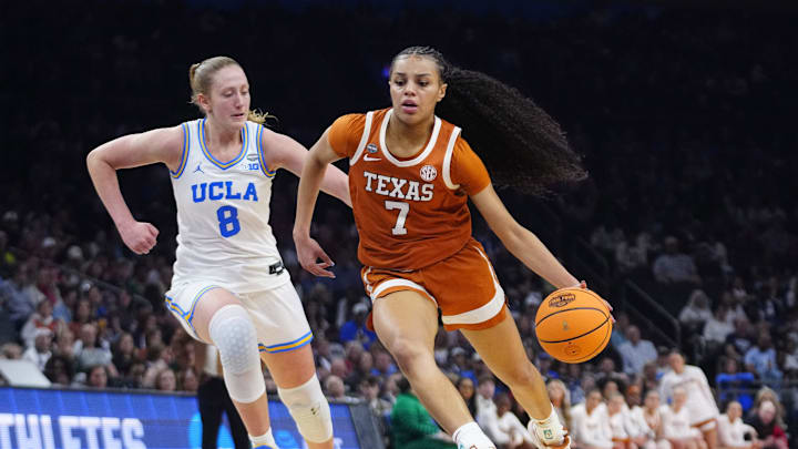 Texas guard Jordan Lee (7) dribbles against UCLA guard Gianna Kneepkens (8) at Mortgage Matchup Center during the Women's Final Four in Phoenix on April 3, 2026.