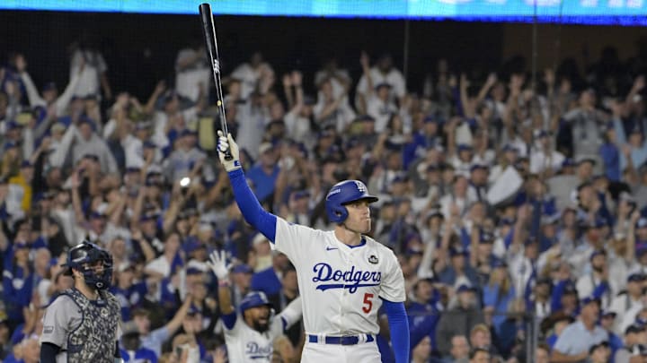 Oct 25, 2024; Los Angeles, California, USA; Los Angeles Dodgers first baseman Freddie Freeman (5) celebrates after hitting a grand slam home run in the tenth inning against the New York Yankees during game one of the 2024 MLB World Series at Dodger Stadium. Mandatory Credit: Jayne Kamin-Oncea-Imagn Images Oct 25, 2024; Los Angeles, California, USA; Los Angeles Dodgers first baseman Freddie Freeman (5) celebrates after hitting a grand slam home run in the tenth inning against the New York Yankees during game one of the 2024 MLB World Series at Dodger Stadium. Mandatory Credit: Jayne Kamin-Oncea-Imagn Images