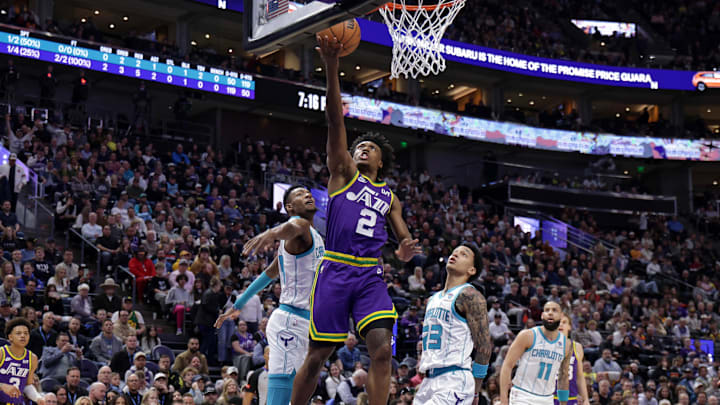 Feb 22, 2024; Salt Lake City, Utah, USA;  Utah Jazz guard Collin Sexton (2) gets past Charlotte Hornets forward Brandon Miller (24) and lays the ball up to the basket during the first quarter at Delta Center. Mandatory Credit: Chris Nicoll-Imagn Images
