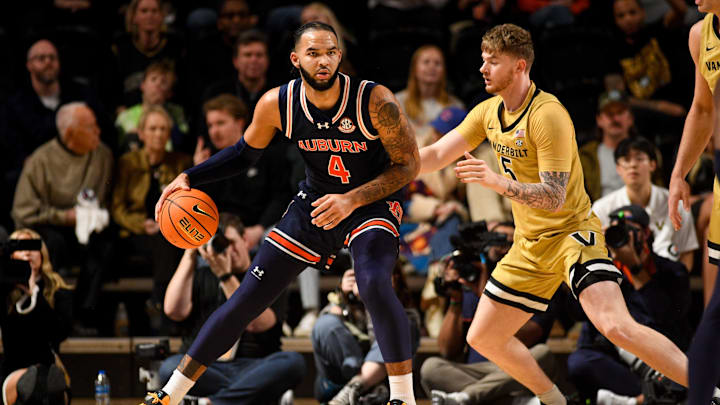 Feb 11, 2025; Nashville, Tennessee, USA;  Auburn Tigers forward Johni Broome (4) backs down Vanderbilt Commodores guard Tyler Nickel (5)] during the first half at Memorial Gymnasium. Mandatory Credit: Steve Roberts-Imagn Images