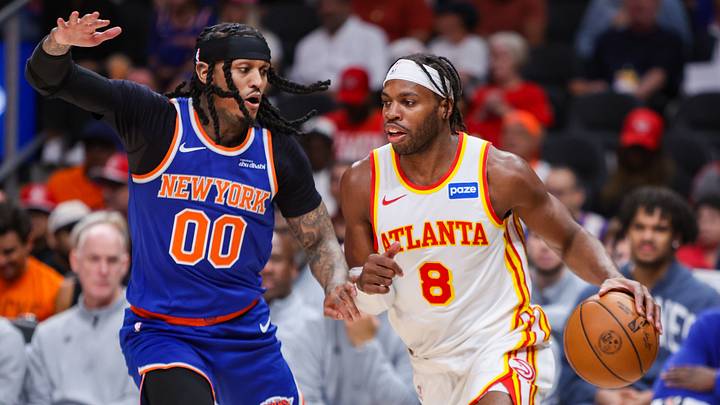 Apr 30, 2026; Atlanta, Georgia, USA; New York Knicks guard Jordan Clarkson (00) defends Atlanta Hawks guard Buddy Hield (8) in the third quarter during game six of the first round of the 2026 NBA Playoffs at State Farm Arena. Mandatory Credit: Brett Davis-Imagn Images