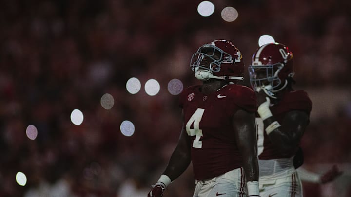 Aug 31, 2024; Tuscaloosa, Alabama, USA; Alabama Crimson Tide linebacker Qua Russaw (4) walks onto the field with Alabama’s defense during the second quarter at Bryant-Denny Stadium. Mandatory Credit: Will McLelland-Imagn Images