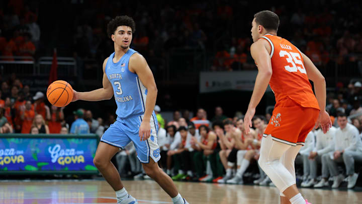 Feb 10, 2026; Coral Gables, Florida, USA; North Carolina Tar Heels guard Derek Dixon (3) dribbles the basketball as Miami Hurricanes guard Dante Allen (35) defends during the second half at Watsco Center. Mandatory Credit: Sam Navarro-Imagn Images Feb 10, 2026; Coral Gables, Florida, USA; North Carolina Tar Heels guard Derek Dixon (3) dribbles the basketball as Miami Hurricanes guard Dante Allen (35) defends during the second half at Watsco Center. Mandatory Credit: Sam Navarro-Imagn Images