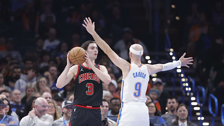 Mar 31, 2025; Oklahoma City, Oklahoma, USA; Chicago Bulls guard Josh Giddey (3) looks to pass as Oklahoma City Thunder guard Alex Caruso (9) defends during the second quarter at Paycom Center. Mandatory Credit: Alonzo Adams-Imagn Images