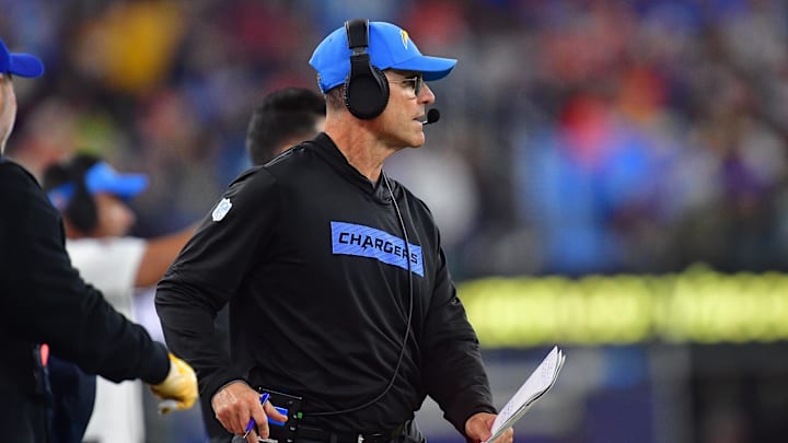 Dec 19, 2024; Inglewood, California, USA; Los Angeles Chargers head coach Jim Harbaugh watches game action before playing against the Denver Broncos during the first half at SoFi Stadium. Mandatory Credit: Gary A. Vasquez-Imagn Images