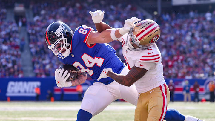 New York Giants tight end Theo Johnson (84) and San Francisco 49ers cornerback Deommodore Lenoir (2) New York Giants tight end Theo Johnson (84) and San Francisco 49ers cornerback Deommodore Lenoir (2)