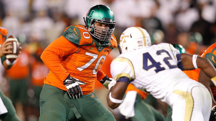 Oct 4, 2014; Atlanta, GA, USA; Miami Hurricanes offensive lineman Jon Feliciano (70) blocks against the Georgia Tech Yellow Jackets in the fourth quarter at Bobby Dodd Stadium. Georgia Tech defeated Miami 28-17. Mandatory Credit: Brett Davis-Imagn Images