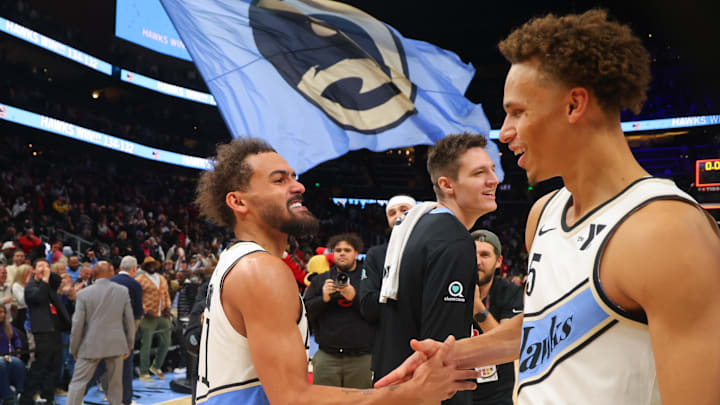 Dec 6, 2024; Atlanta, Georgia, USA; Atlanta Hawks guard Trae Young (11) celebrates with guard Dyson Daniels (5) after an overtime victory over the Los Angeles Lakers at State Farm Arena. Mandatory Credit: Brett Davis-Imagn Images
Dec 6, 2024; Atlanta, Georgia, USA; Atlanta Hawks guard Trae Young (11) celebrates with guard Dyson Daniels (5) after an overtime victory over the Los Angeles Lakers at State Farm Arena. Mandatory Credit: Brett Davis-Imagn Images