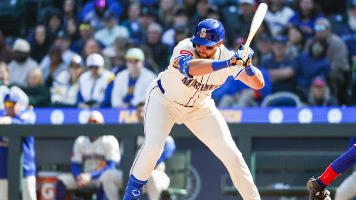 Seattle Mariners catcher Cal Raleigh (29) is hit by a pitch in the foot during the sixth inning against the Texas Rangers at T-Mobile Park on April 13. Seattle Mariners catcher Cal Raleigh (29) is hit by a pitch in the foot during the sixth inning against the Texas Rangers at T-Mobile Park on April 13.