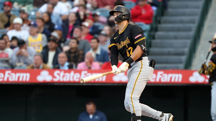 Apr 24, 2025; Anaheim, California, USA;  Pittsburgh Pirates first baseman Matt Gorski (62) hits a home run during the first inning against the Los Angeles Angels at Angel Stadium. Gorski hits his first MLB home run in the first MLB at bat. Mandatory Credit: Kiyoshi Mio-Imagn Images