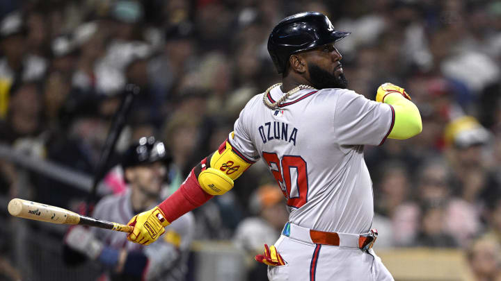 Jul 12, 2024; San Diego, California, USA; Atlanta Braves designated hitter Marcell Ozuna (20) hits a home run against the San Diego Padres during the ninth inning at Petco Park. Mandatory Credit: Orlando Ramirez-USA TODAY Sports 
