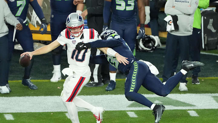 Feb 8, 2026; Santa Clara, CA, USA; New England Patriots quarterback Drake Maye (10) is pressured by Seattle Seahawks linebacker Ernest Jones IV (13) in the second half in Super Bowl LX at Levi's Stadium. Mandatory Credit: Kirby Lee-Imagn Images
