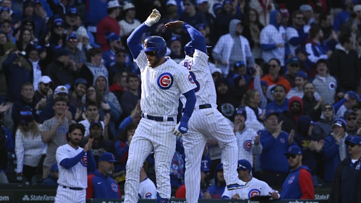 Apr 8, 2023; Chicago, Illinois, USA;  Chicago Cubs third baseman Patrick Wisdom (16) high fives