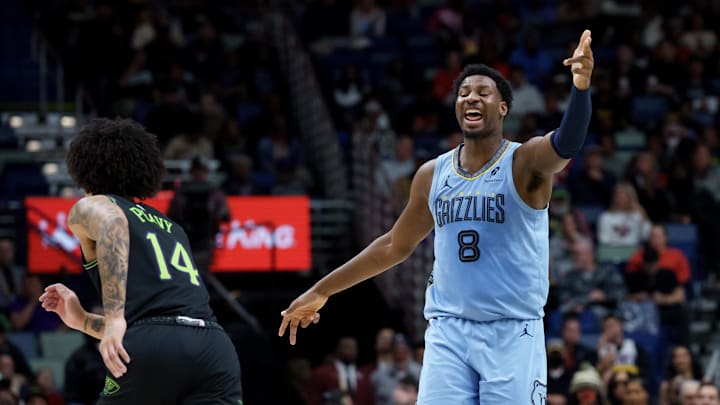 Jan 30, 2026; New Orleans, Louisiana, USA; Memphis Grizzlies forward Jaren Jackson Jr. (8) reacts after a three point basket against New Orleans Pelicans guard Micah Peavy (14) during the first half at Smoothie King Center. Mandatory Credit: Matthew Hinton-Imagn Images