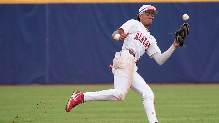May 20, 2026; Hoover, AL, USA; Alabama shortstop Justin Lebron makes an error on a ball hit up the middle in the SEC Tournament game between Florida and Alabama at the Hoover Met. May 20, 2026; Hoover, AL, USA; Alabama shortstop Justin Lebron makes an error on a ball hit up the middle in the SEC Tournament game between Florida and Alabama at the Hoover Met.