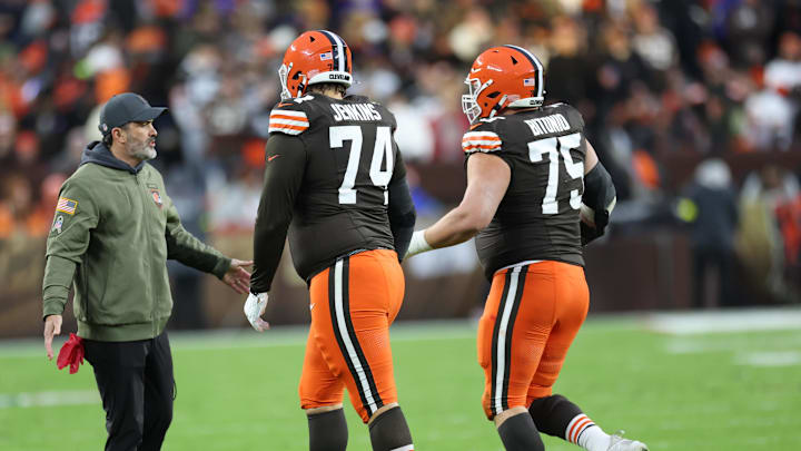 Nov 16, 2025; Cleveland, Ohio, USA; Cleveland Browns head coach Kevin Stefanski high-fives guard Teven Jenkins (74) and guard Teven Jenkins (74) during the first quarter against the Baltimore Ravens at Huntington Bank Field. Mandatory Credit: Scott Galvin-Imagn Images