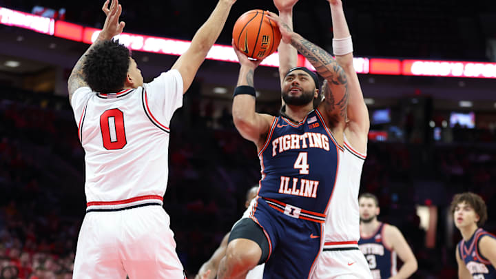 Dec 9, 2025; Columbus, Ohio, USA; Illinois Fighting Illini guard Kylan Boswell (4) drives to the basket as Ohio State Buckeyes guard John Mobley Jr. (0) defends during the first half Value City Arena. Mandatory Credit: Joseph Maiorana-Imagn Images Dec 9, 2025; Columbus, Ohio, USA; Illinois Fighting Illini guard Kylan Boswell (4) drives to the basket as Ohio State Buckeyes guard John Mobley Jr. (0) defends during the first half Value City Arena. Mandatory Credit: Joseph Maiorana-Imagn Images