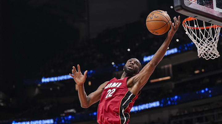 Feb 24, 2025; Atlanta, Georgia, USA; Miami Heat forward Andrew Wiggins (22) reaches for a rebound against the Atlanta Hawks during the first half at State Farm Arena. Mandatory Credit: Dale Zanine-Imagn Images