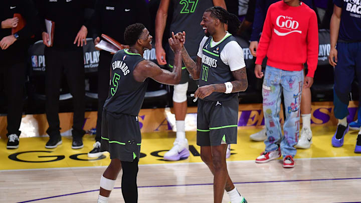 Apr 30, 2025; Los Angeles, California, USA; Minnesota Timberwolves guard Anthony Edwards (5) and center Naz Reid (11) celebrate the series victory against the Los Angeles Lakers in game five of first round for the 2025 NBA Playoffs at Crypto.com Arena. Mandatory Credit: Gary A. Vasquez-Imagn Images