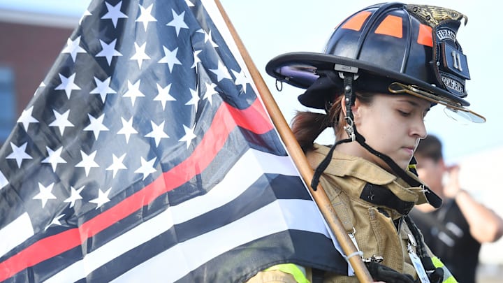 The Annual 2024 Greenville 9/11 Memorial Stair Climb took place at Fluor Field on Sept. 7, 2024. The event honors the FDNY firefighters and first responders and others who selflessly gave their lives on Sept. 11, 2001. Here, a firefighter walks the stairs as the bells are sounded to mark the day America was attacked.