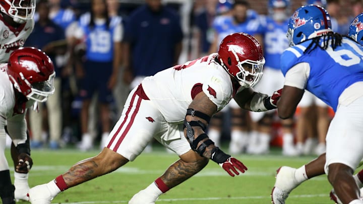 Sep 13, 2025; Oxford, Mississippi, USA; Arkansas Razorback defensive lineman Ian Geffrard (95) defends during the third quarter during the third quarter at Vaught-Hemingway Stadium. Mandatory Credit: Petre Thomas-Imagn Images Sep 13, 2025; Oxford, Mississippi, USA; Arkansas Razorback defensive lineman Ian Geffrard (95) defends during the third quarter during the third quarter at Vaught-Hemingway Stadium. Mandatory Credit: Petre Thomas-Imagn Images