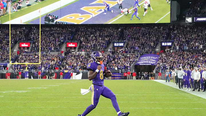 Nov 7, 2024; Baltimore, Maryland, USA; Baltimore Ravens quarterback Lamar Jackson (8) scores a two point conversion during the fourth quarter against the Cincinnati Bengals at M&T Bank Stadium. Mandatory Credit: Mitch Stringer-Imagn Images